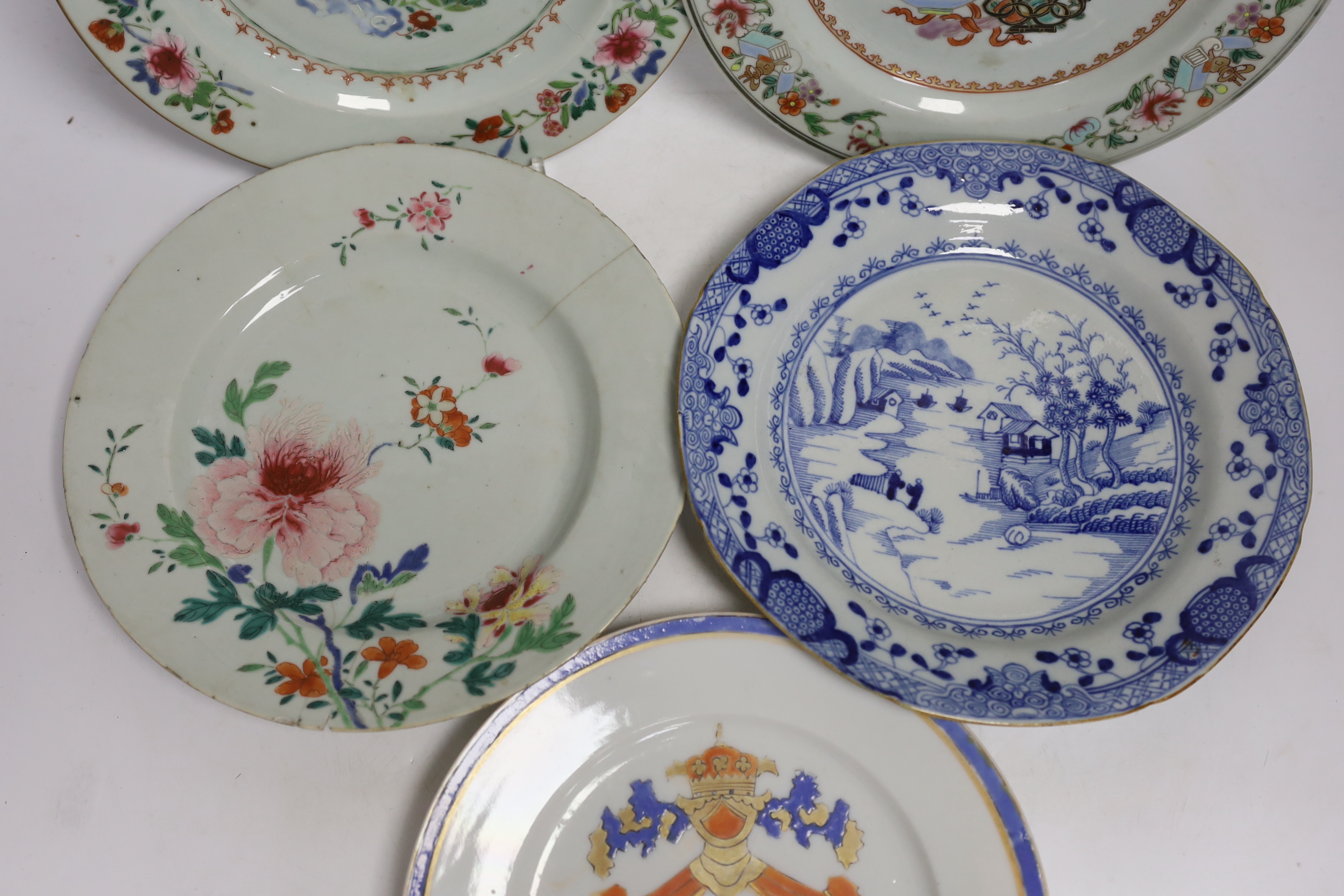 Four 18th century Chinese porcelain plates, and a later armorial plate, 21.5cm